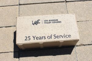 Brick on the ground engraved 25 years of service