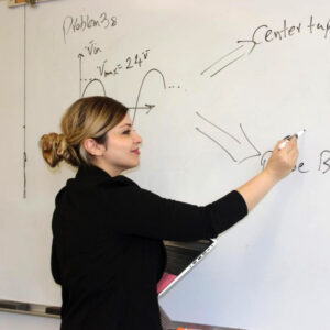 Instructor working at white board